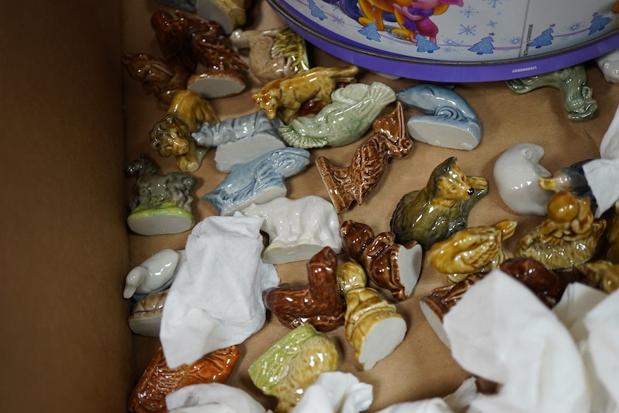 A large collection of Wade Whimsies including Disney Characters and a collection of blown glass animal figures